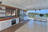 Modern St Barts villa living room with ocean views, airy design, and plush seating for relaxation.