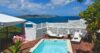 Private pool deck at a St Barts villa rental with loungers and sweeping Caribbean sea views.
