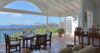 Open-air dining terrace at a St Barts vacation rental with panoramic sea views.