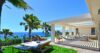 Ocean-view terrace with hammock, sun loungers, and shaded lounge area at a luxury villa in St Barts.