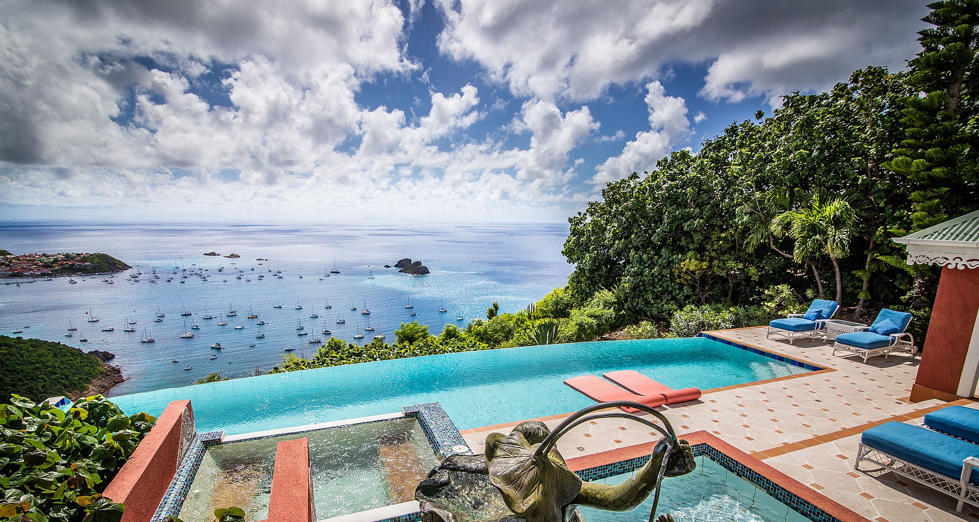 Clifftop infinity pool at St Barts villa with panoramic ocean and harbor views