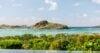 Relaxing pool lounge furnished with loungers, offering panoramic views of the surrounding landscape