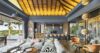 A tranquil terrace where soft cushions meet a sweeping horizon, bathed in warm, golden light.