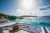 Luxury villa terrace in St Barts with infinity pool overlooking the Caribbean Sea.