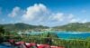 Panoramic ocean view with sun loungers on a terrace overlooking turquoise waters at a hillside St Barts villa rental.