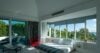 Modern bedroom design featuring large windows framing stunning natural scenery.