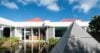 Contemporary villa with sleek architecture and panoramic Caribbean views.