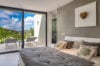Bedroom in St Barths villa rental with terrace access and hillside views