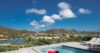 Rooftop pool terrace with sun loungers and hillside views at St Barts villa rental