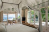 “Interior with large windows offering stunning panoramic views.