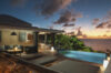 Sunset view from private villa terrace with infinity pool overlooking the Caribbean Sea in St Barts