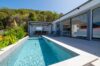 Private villa rental in St Barts with a sunlit pool, tropical garden, and modern outdoor dining terrace.