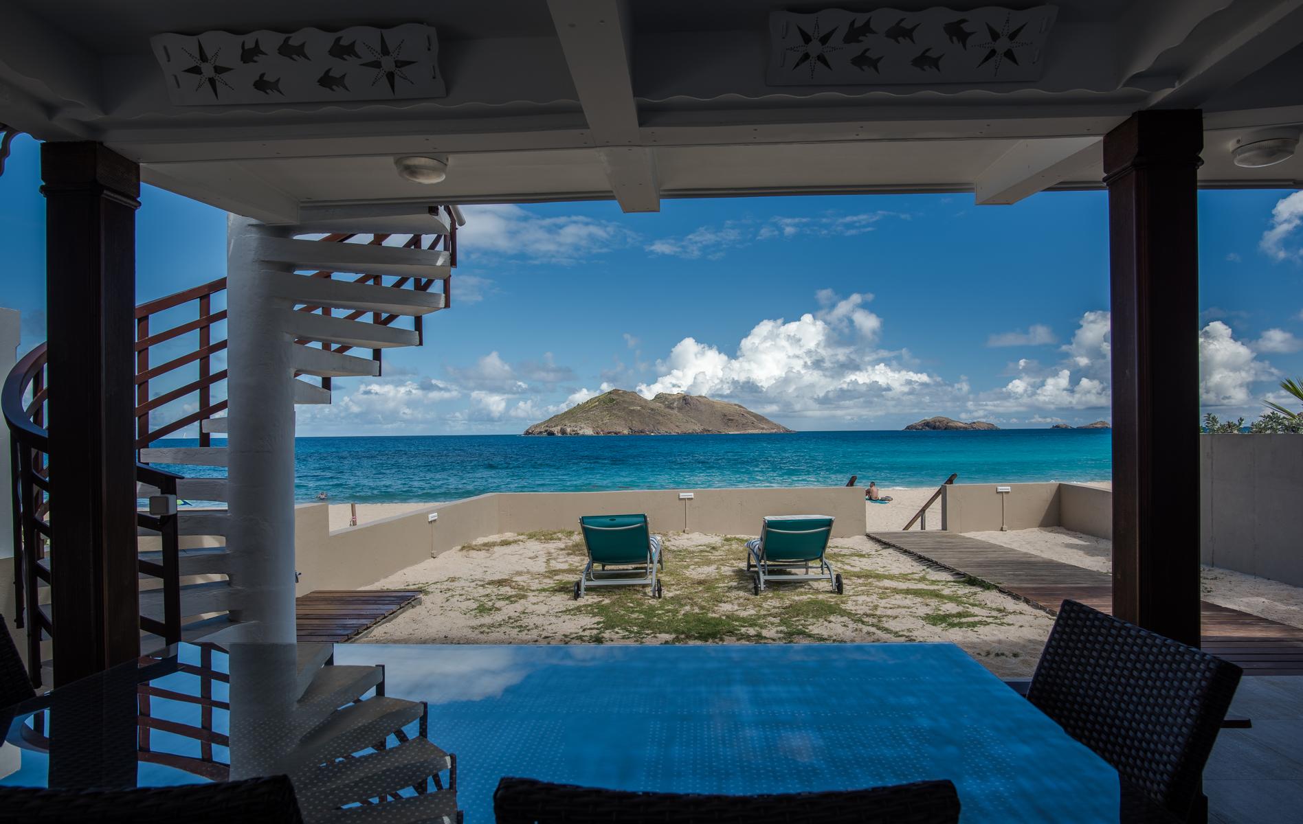 Luxury beachfront villa in St Barts with shaded terrace, private dining area, and direct access to Flamands beach.