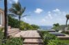 Wooden deck with jacuzzi and panoramic ocean view at St Barts villa rental