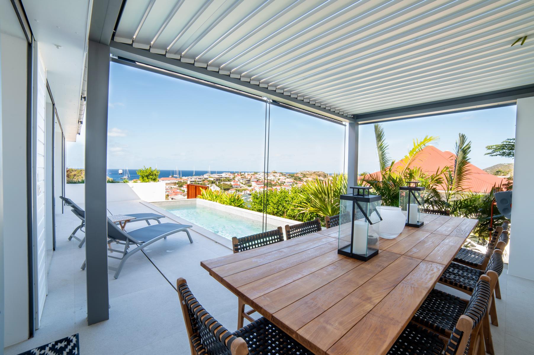 Gourmet creations served in comfort, framed by floor-to-ceiling views of the Caribbean.