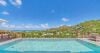 Seaside infinity pool at a St Barts villa with panoramic views of turquoise waters.