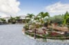 St Barts villa with landscaped tropical garden, palm trees, and stone driveway leading to the main residence.
