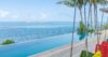 Sunlit infinity pool at a St Barts villa with sweeping Caribbean Sea views and tropical horizon.