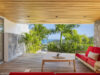Terrace at Villa Loukoko in St Barts overlooking the ocean with open-air seating.