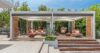 Shaded outdoor lounge with cushioned seating and wooden accents at private villa rental St Barts