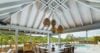 Covered outdoor dining area in a St Barts villa rental with pool views and vaulted ceiling.