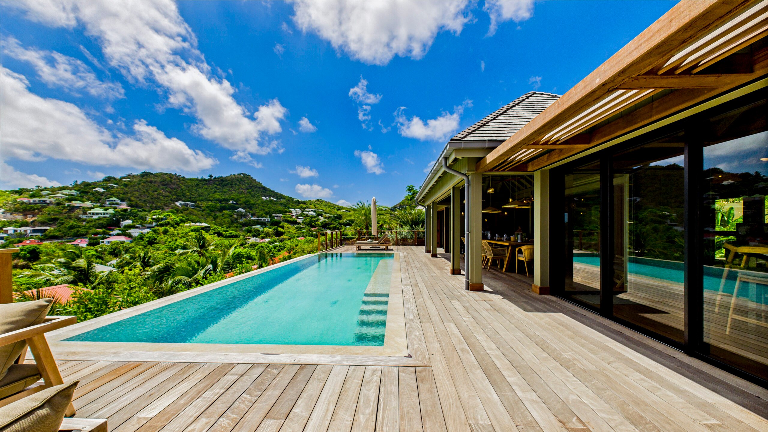 Luxury villa suite in St Barts with soft natural light and sweeping Caribbean horizon.