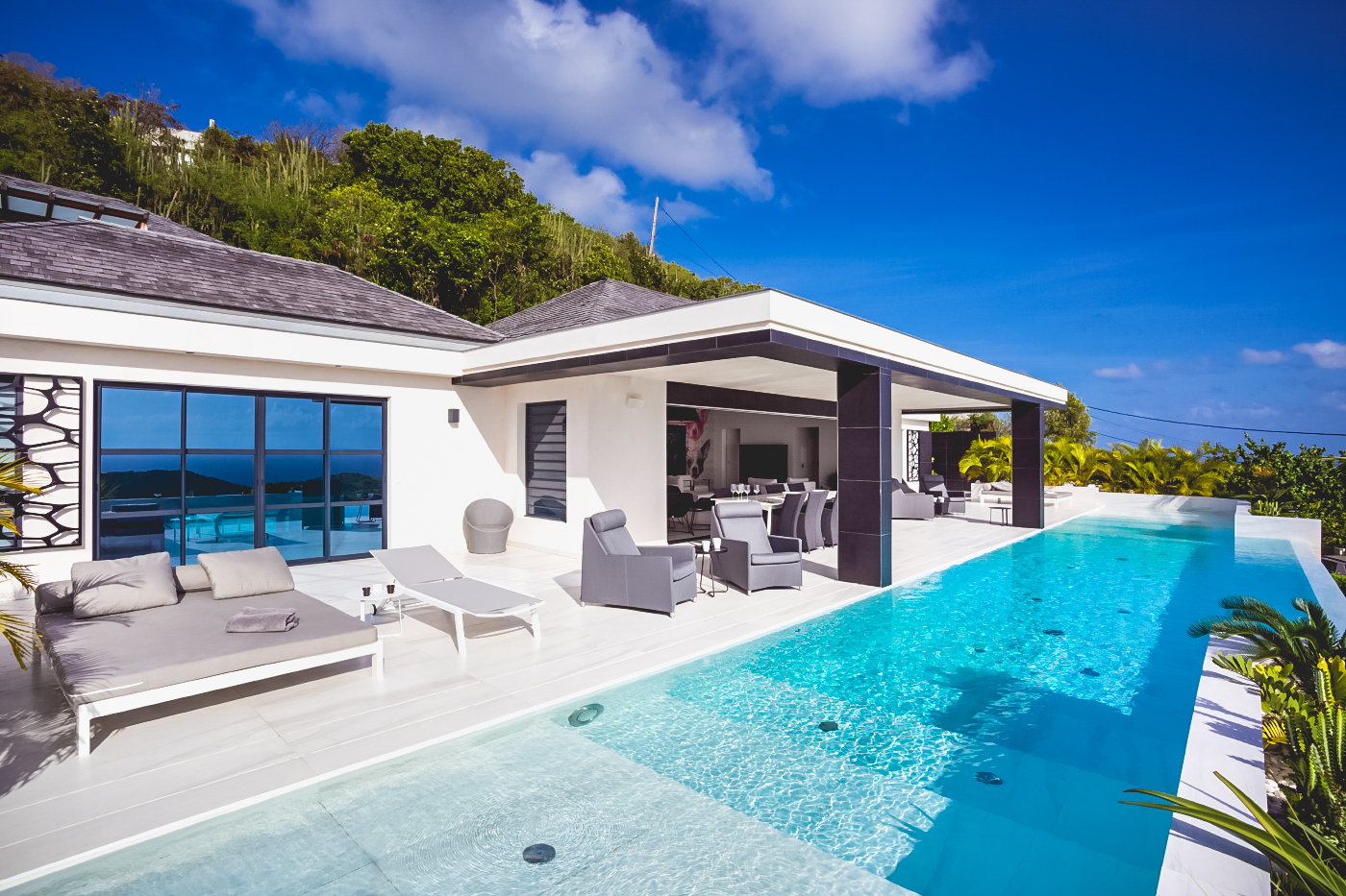 Villa with infinity pool, outdoor lounge, and sea views in St Barts luxury rentals.