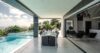 Covered terrace with dining table beside infinity pool at St Barts villa rental.