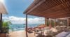 Luxury villa terrace in St Barts with shaded lounge, infinity pool, and panoramic ocean views over anchored yachts
