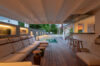 Covered lounge with cushioned seating and bar area beside private pool at St Barts villa rental
