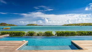 Infinity pool overlooking turquoise sea in Grand Cul-de-Sac