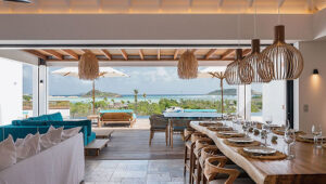 A viila in St. Barts with open living and dining area with ocean view.
