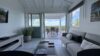 Bright living room with terrace access and sea views at a St Barts vacation rental villa.