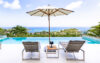 Infinity pool with sun loungers and umbrella overlooking the Caribbean Sea at a St Barts villa rental