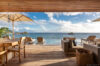 Luxury villa terrace in St Barts with infinity pool, sun loungers, and panoramic ocean views