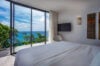 Luxury St Barts villa with sleek infinity pool, ocean view, and floor-to-ceiling glass doors.