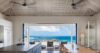 Open kitchen and dining area in St Barts villa with ocean view terrace.