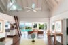 Spacious open-plan living room with pool and ocean views at a St Barts vacation rental villa