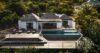 Luxury hillside villa in St Barts with a sleek infinity pool, expansive wooden deck, outdoor lounge chairs, and panoramic views of the Caribbean Sea.