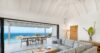 Elegant open-plan living room in a St Barts villa with ocean-view terrace, infinity pool, and modern Caribbean design