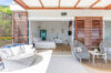 Terrace lounge with chairs leading to bedroom in St Barts villa.