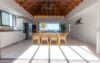 Open dining area with wooden ceiling and sea view at contemporary luxury villa rental in St Barths