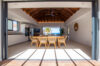Open-air dining room with ocean view and wooden ceiling inside beachfront villa rental in St Barthélemy