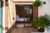 Bedroom with sliding glass doors opening onto private terrace at contemporary villa rental in St Barthélemy