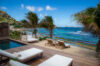 Beachfront villa terrace with sun loungers, private plunge pool, and ocean view in St Barts