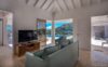 Bright living room with vaulted ceiling and sea-view terrace at a private St Barts villa rental.