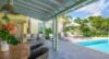 Tropical flowers and pool view evoke scent, color, and relaxation