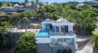 Aerial view of cliffside villa with infinity pool and ocean backdrop in St Barths luxury rentals