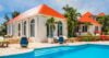 Bright Caribbean villa with red roof and turquoise pool, luxury vacation rental in St Barts