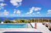 Infinity pool overlooking turquoise Caribbean Sea and hillside views from a luxury villa rental in St Barts